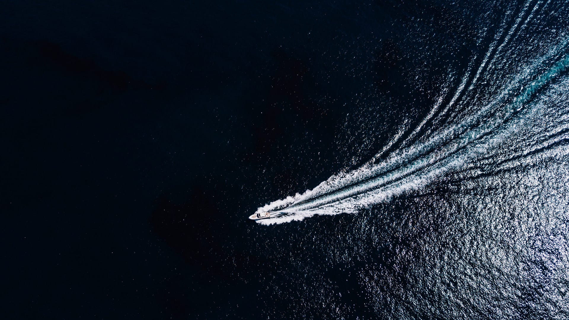 Sea Boat sealing in ocean view from above. Aerial view of moving boat or yacht in sea. Sea Prop